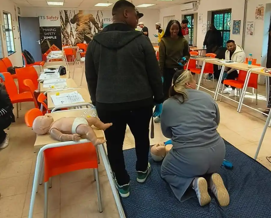 Accredited First Aid Level 1 training course at FTS Safety with learners practising CPR during practical workplace emergency response training in South Africa
